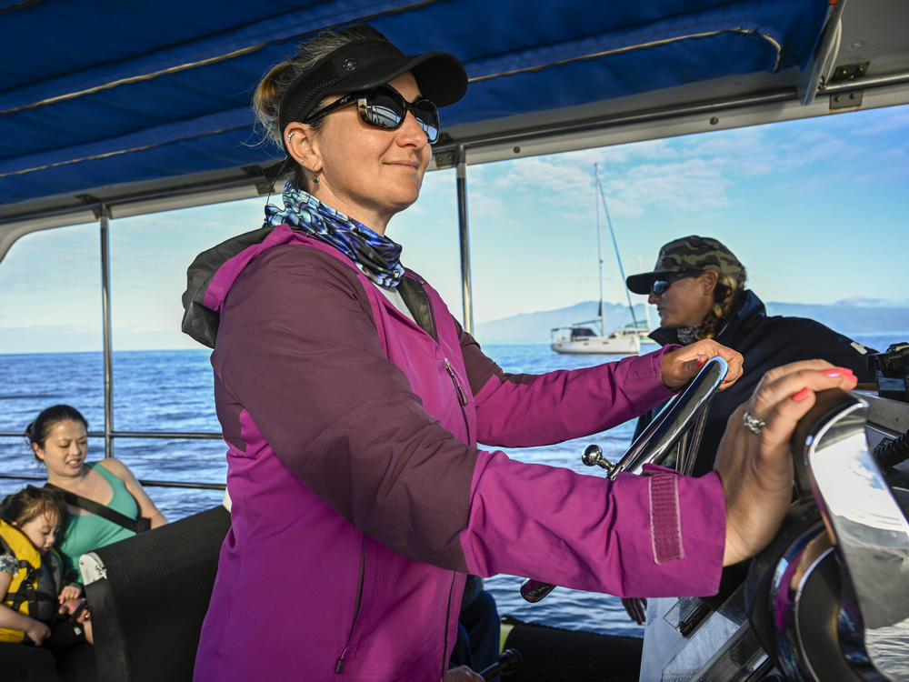 Co-captains Kristina Rau (left) and Sarah Haken (right) say being back on the water brings some normalcy to lives disrupted by the Lahaina wildfires. They ask visitors to keep the focus on the whales and not ask about their losses.