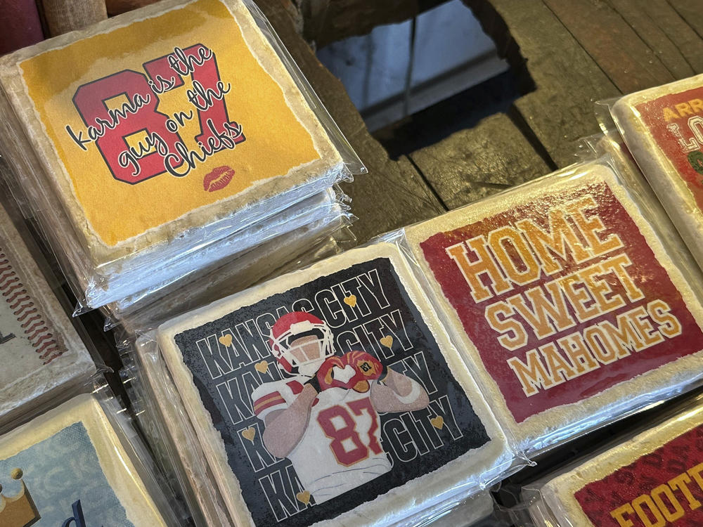 Coasters from Westside Storey commemorating Swift and Kelce's relationship are displayed in Kansas City, Mo., on Monday.