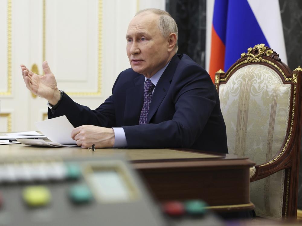 Russian President Vladimir Putin gestures while speaking at a meeting of the Presidential Council for Science and Education via videoconference at the Kremlin in Moscow, Thursday.