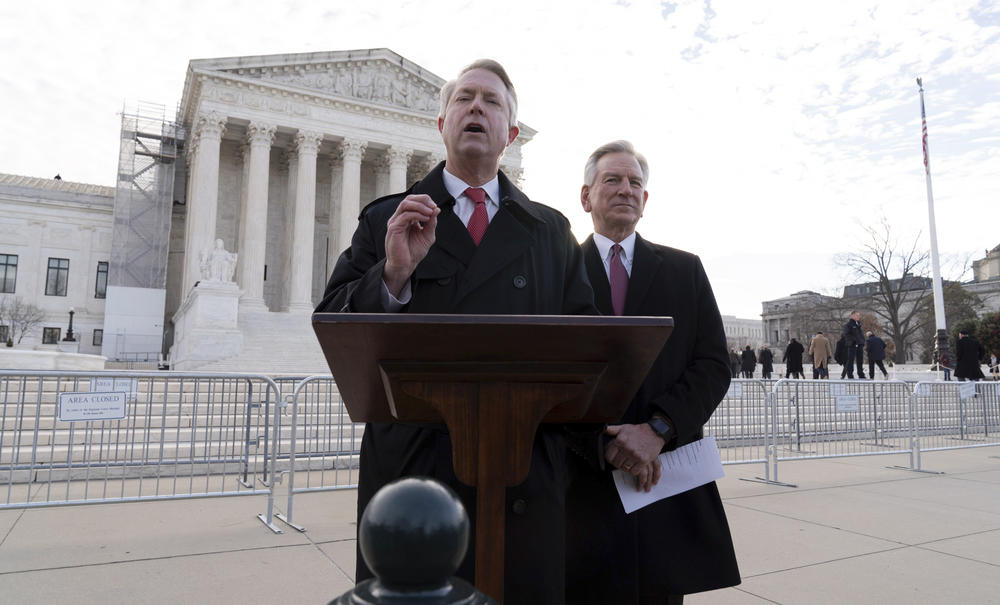 Trump allies Sen. Roger Marshall, R-Kan., and Sen. Tommy Tuberville, R-Ala., speak to reporters outside the U.S. Supreme Court on Thursday.