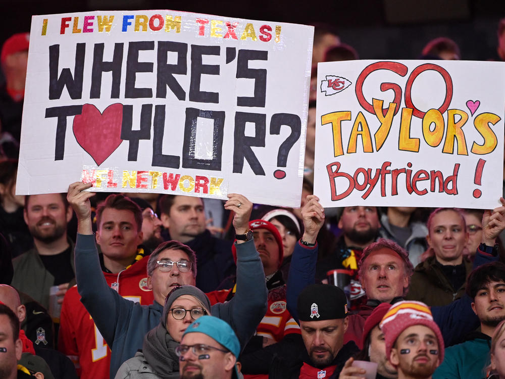 Fans hold up signs during the NFL game between Miami Dolphins and Kansas City Chiefs in Germany in November.