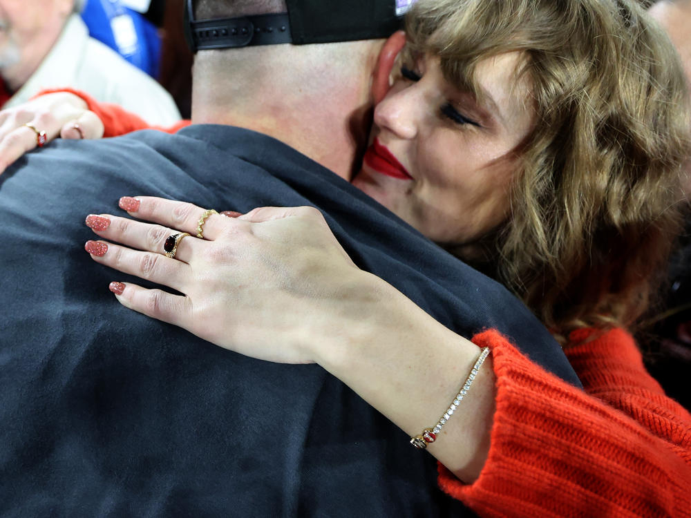 Taylor Swift hugs Kansas City Chiefs player Travis Kelce after a game last month against the Baltimore Ravens as she wears a diamond bracelet designed by Wove, a company founded by two former U.S. Army Rangers.
