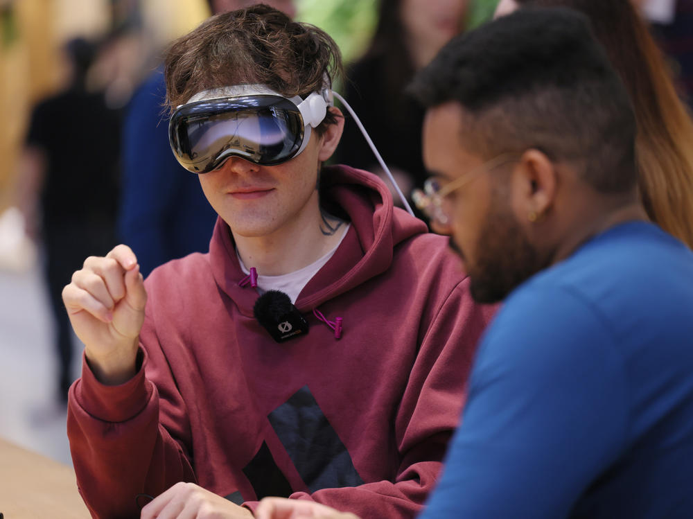 A person tries out an Apple Vision Pro headset at an Apple store in New York City on Feb. 2.