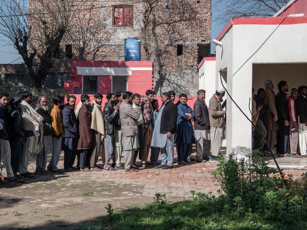 Pakistan voters queue to cast their ballots at a polling station in Pakistan's general election on Feb. 8, in Wahgrian, Pakistan. The elections have direct implications for Pakistan's global credibility, particularly in strategic and economic relationships.