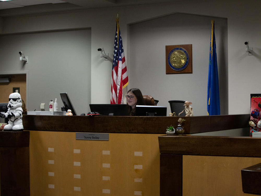 Bailey smiles at a young adult showing progress during DAAY court in Las Vegas.