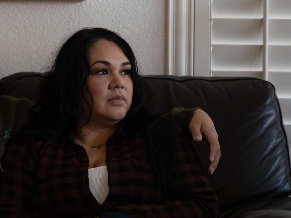 D. Lopez sits with her son at their residence in Las Vegas.