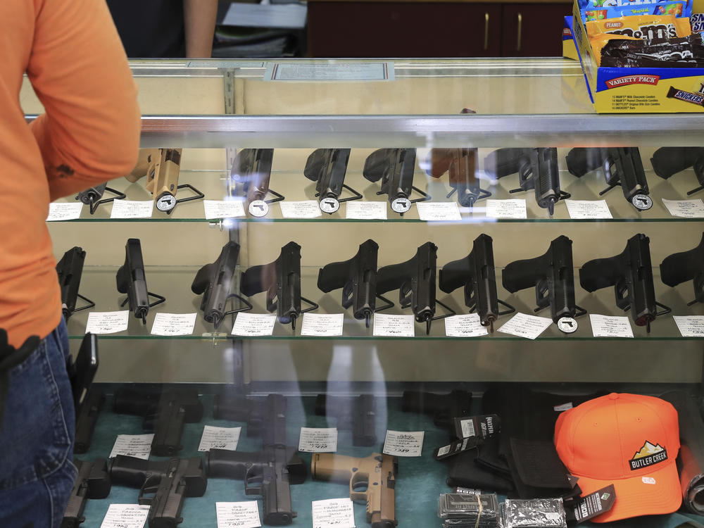 Handguns are displayed at a gun shop on June 23, 2022, in Honolulu. A ruling by Hawaii's high court saying that a man can be prosecuted for carrying a gun in public without a permit uses pop culture references in an apparent rebuke of a U.S. Supreme Court decision that expanded gun rights nationwide.