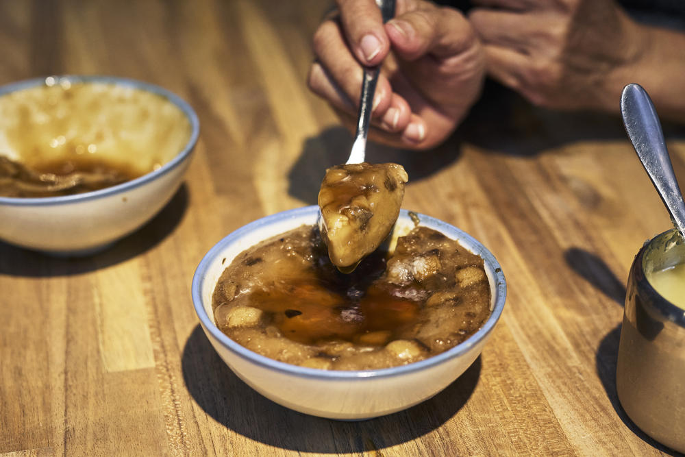 A bowl of traditional wa gui, a savory steamed rice cake.