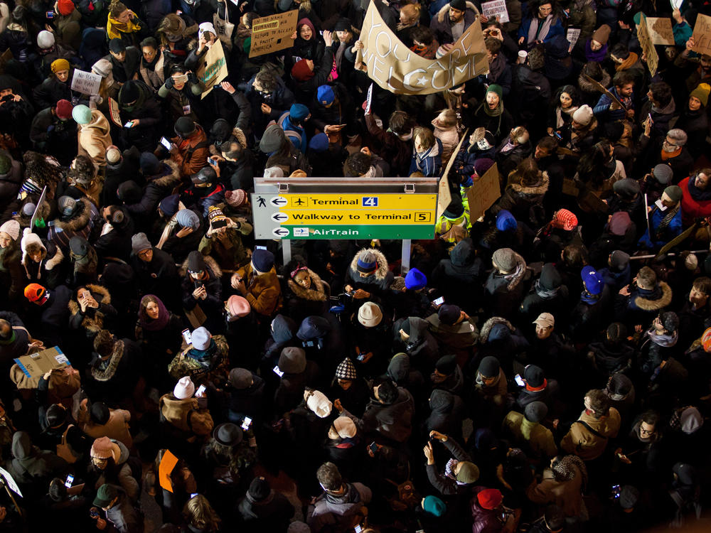 Demonstrators gather outside of John F. Kennedy International Airport airport in New York to protest shortly after former President Donald Trump's executive order blocking visitors from seven predominantly Muslim nations went into effect in January 2017. Trump is promising to implement even more extreme immigration policies if he wins another term in November.