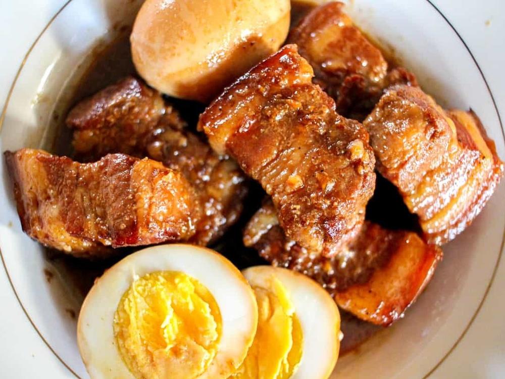 <em>Thit kho trung, </em>or caramelized pork belly with eggs, is Kimberly Huynh's favorite Lunar New Year dish. She loves how the meat falls apart after hours of braising.