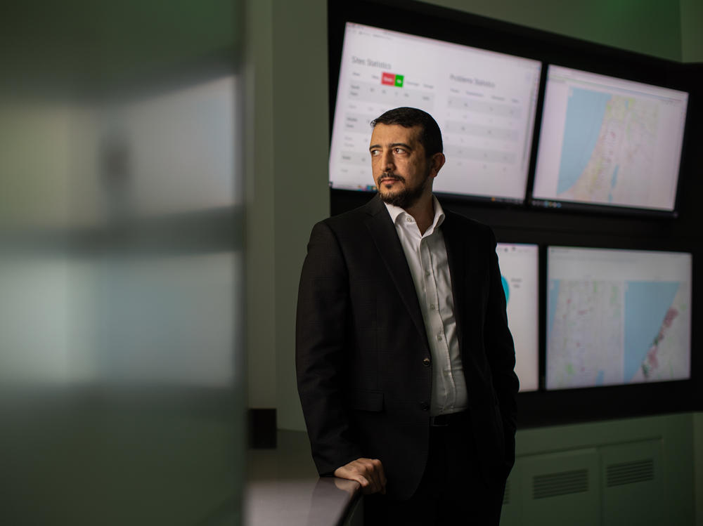 Hamzah Naseef, head of core operations for the Palestinian Telecommunications Co., stands in the operations center of the Paltel headquarters in Ramallah, West Bank. Paltel has more than 500 cell towers in Gaza, and 80% of them have been destroyed during the war, Naseef says.