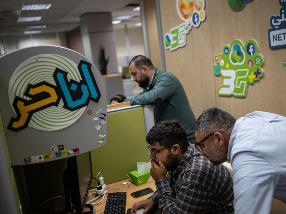 Employees work at the Paltel headquarters in Ramallah in the West Bank on Jan. 31.