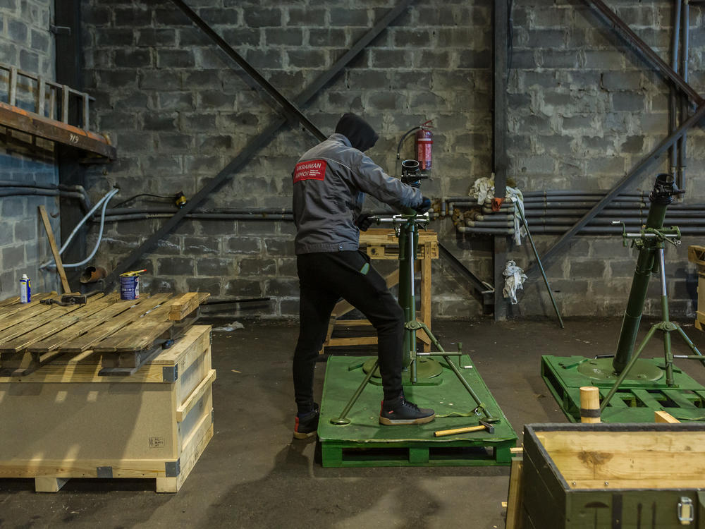 A worker builds mortar launchers in the mortar assembly shop of the Ukrainian Armor Design and Manufacturing Co.