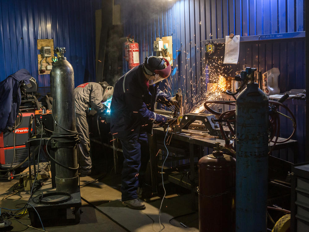 Armored car repair shop workers build an experimental version of a military vehicle in the facility of the Ukrainian Armor Design and Manufacturing Co.