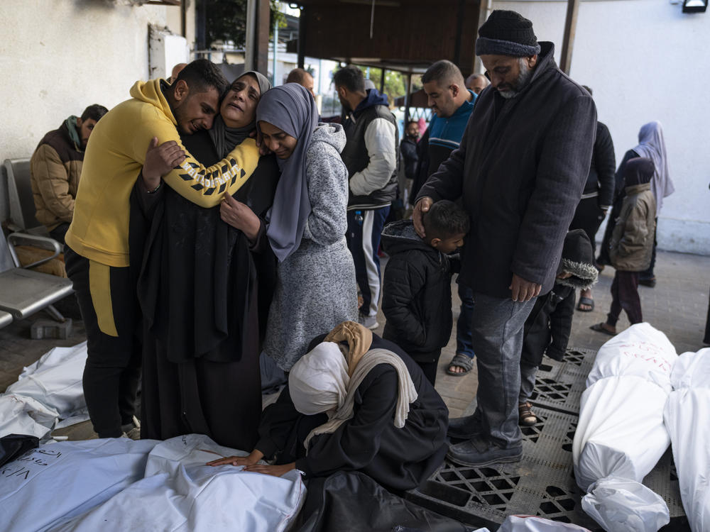 Palestinians mourn their relatives who were killed in the Israeli ground offensive and bombardment of the Gaza Strip, outside a morgue in Rafah on Feb. 8.