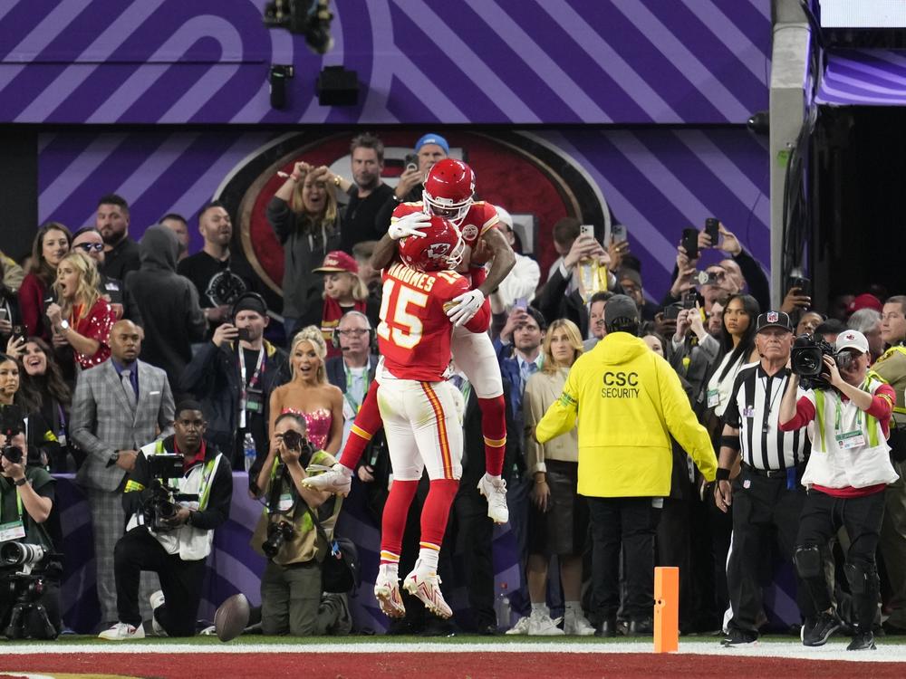 Kansas City Chiefs wide receiver Mecole Hardman Jr. (12) celebrates his game-winning touchdown with quarterback Patrick Mahomes (15) in overtime during the NFL Super Bowl 58 football game against the San Francisco 49ers, Sunday, Feb. 11, 2024, in Las Vegas. The Chiefs won 25-22.