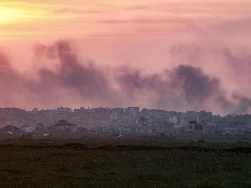 Smoke plumes billow above the Gaza Strip as seen from southern Israel on Sunday, Feb. 11.