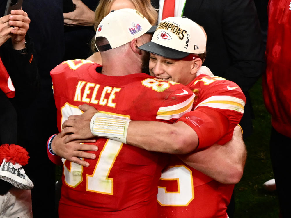Kansas City Chiefs' tight end #87 Travis Kelce and Kansas City Chiefs' quarterback #15 Patrick Mahomes hug after winning Super Bowl LVIII against the San Francisco 49ers at Allegiant Stadium in Las Vegas, Nevada, February 11, 2024.