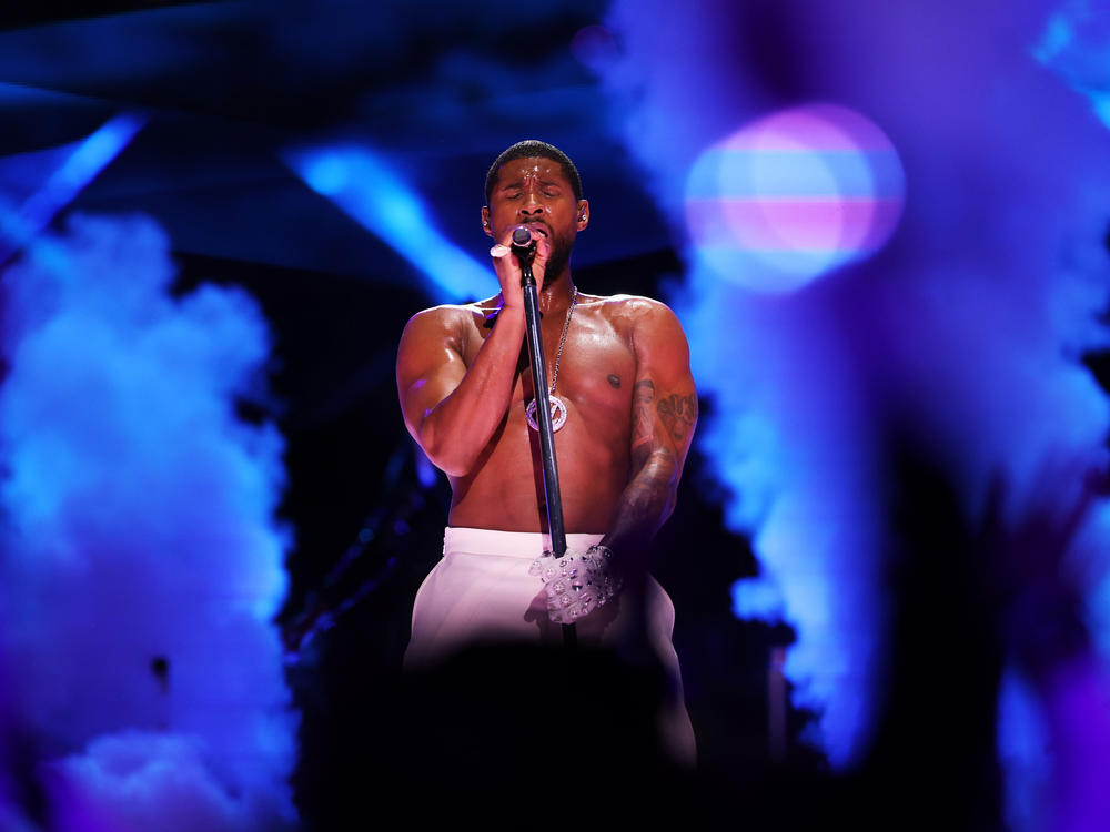 Usher performs onstage during the Apple Music Super Bowl LVIII Halftime Show at Allegiant Stadium in Las Vegas, Nevada.