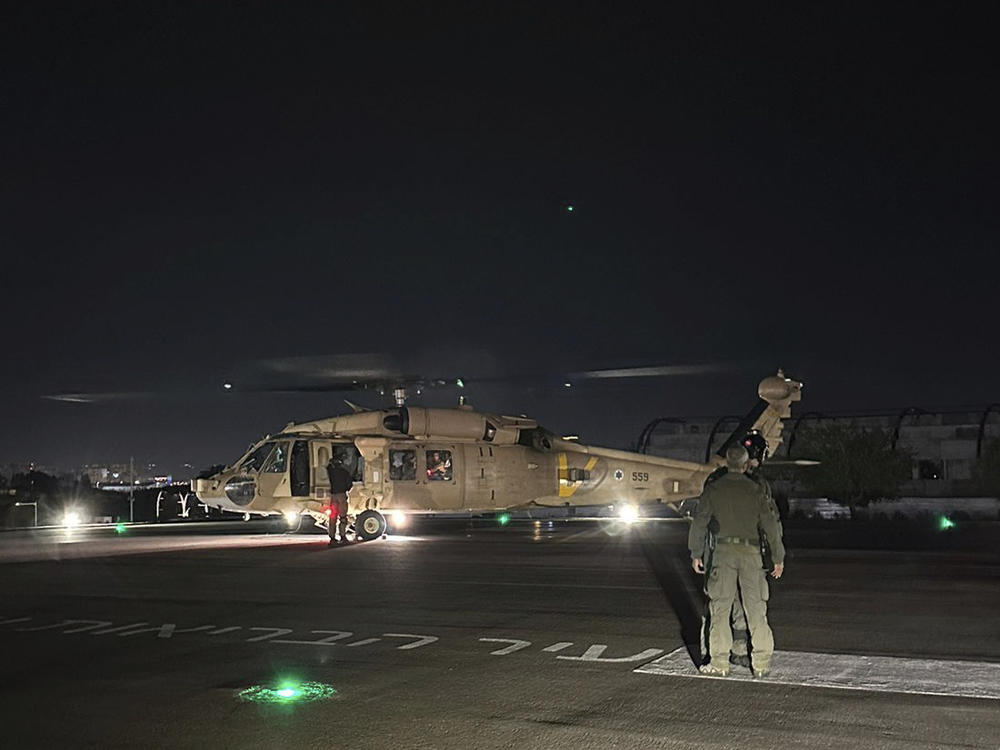 This photo provided by the Israeli military shows an Israeli Air Force helicopter carrying what the military said are two released hostages, at Sheba Medical Center in Ramat Gan, Israel, on Monday.