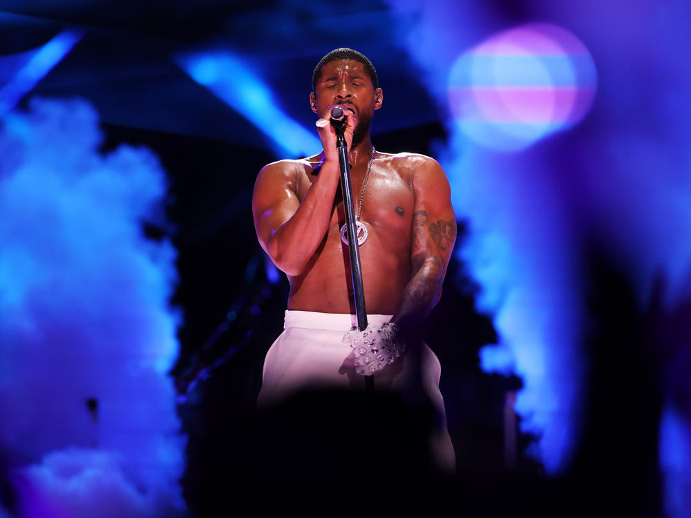 Usher performs onstage during the Apple Music Super Bowl LVIII Halftime Show at Allegiant Stadium in Las Vegas, Nevada.