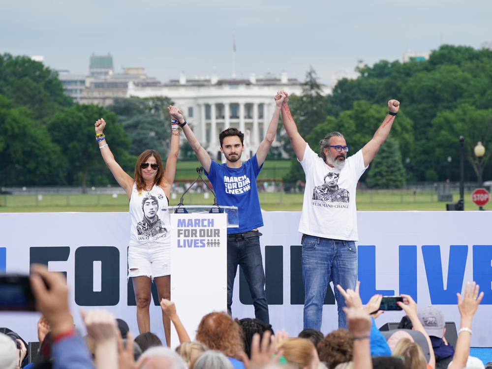Manny Oliver, Patricia Oliver and David Hogg speak during a March for Our Lives rally in June 2022.