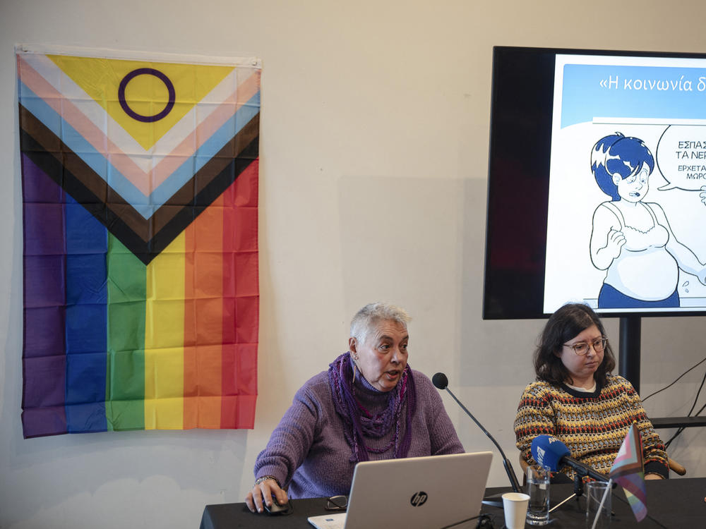 Stella Belia (left), a member of the Rainbow Families of Greece organization for LGBTQ parents, speaks during a press conference at the Onassis Cultural Center in Athens, on Jan. 30.