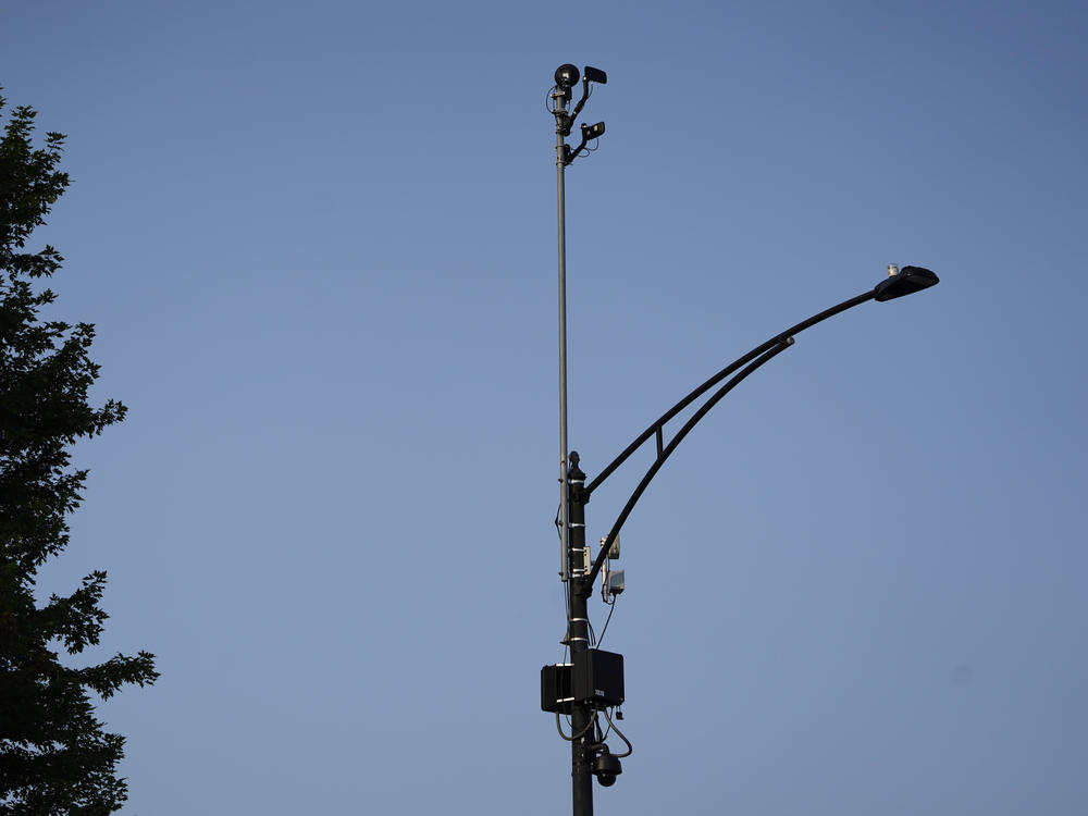 ShotSpotter equipment overlooks the intersection of South Stony Island Avenue and East 63rd Street in Chicago on Aug. 10, 2021. The city will not renew its contract for the gunfire detection equipment.