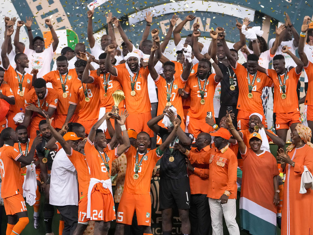 Cote D'Ivoire players celebrate after winning the African Cup of Nations final soccer match between Nigeria and Cote D'Ivoire, at the Olympic Stadium of Ebimpe in Abidjan, Ivory Coast, Sunday, Feb. 11