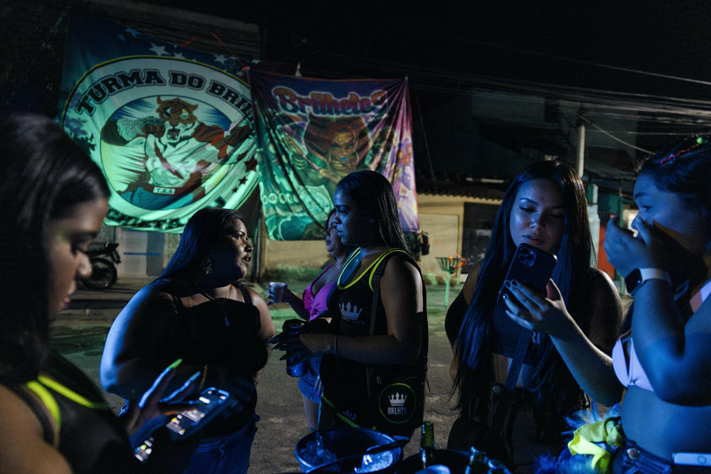 Members of the all-women bate-bola crew Brilhetes gather before their crew's first Carnival presentation in Rio de Janeiro's Anchieta neighborhood.