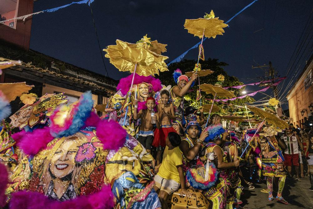 Bate-bola crew Bem Feito goes out during Carnival celebrations in Rio de Janeiro's Pedra de Guaratiba neighborhood on Feb. 11.