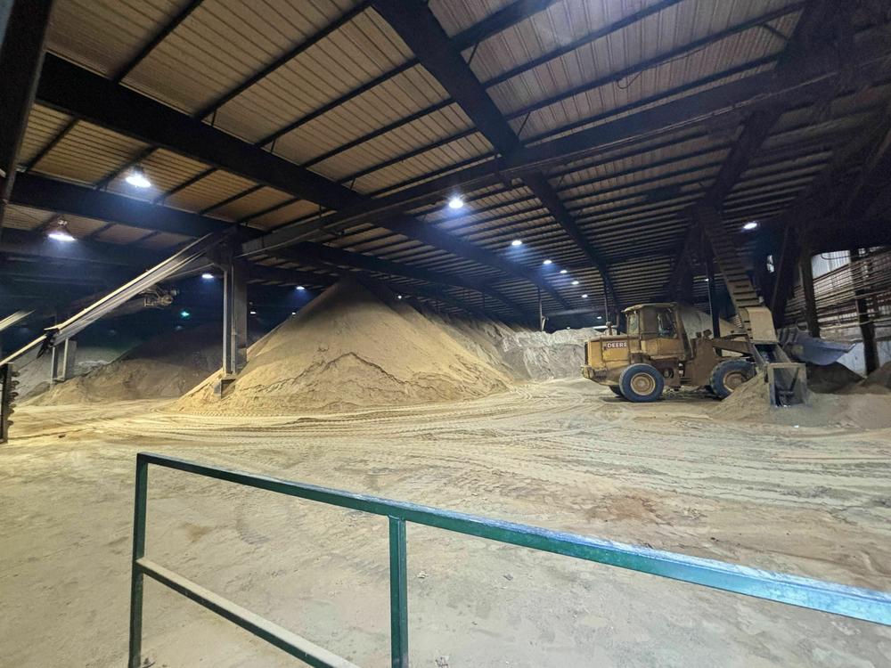 Piles of fish meal, made from menhaden, at Omega Protein's reduction plant in Reedville, Virginia in December. The fish meal is used in products like pet food and for feeding farm-raised salmon and shrimp.