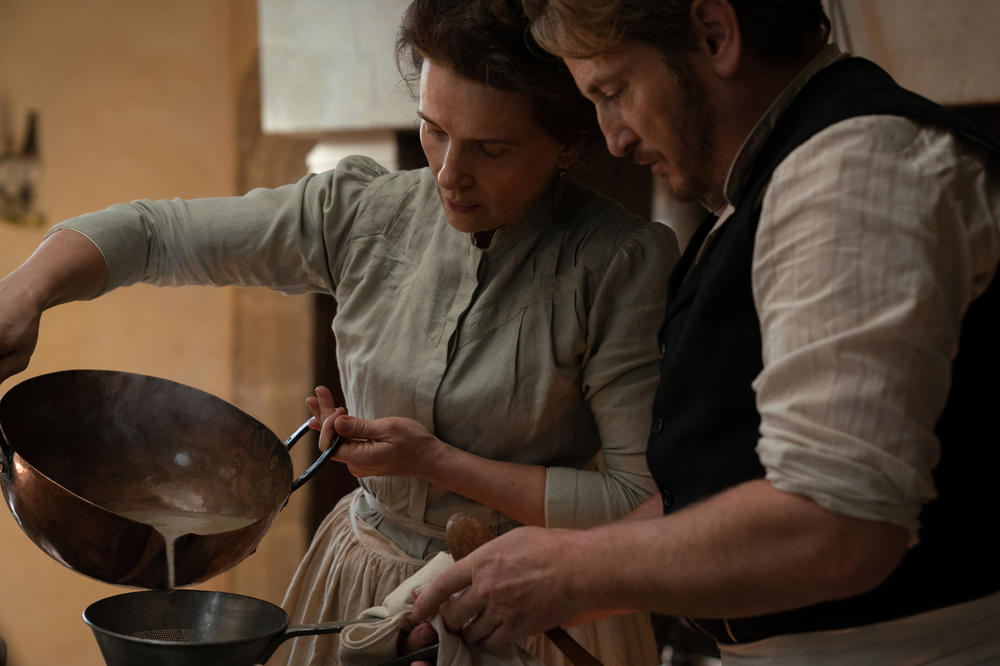 Eugénie (Juliette Binoche) and Dodin Bouffant (Benoît Magimel) love food (and one another) in <em>The Taste of Things</em>. Director Tran Anh Hung aimed for authenticity — from the menu to the movements in the kitchen — and enlisted three-star chef Pierre Gagnaire to help.