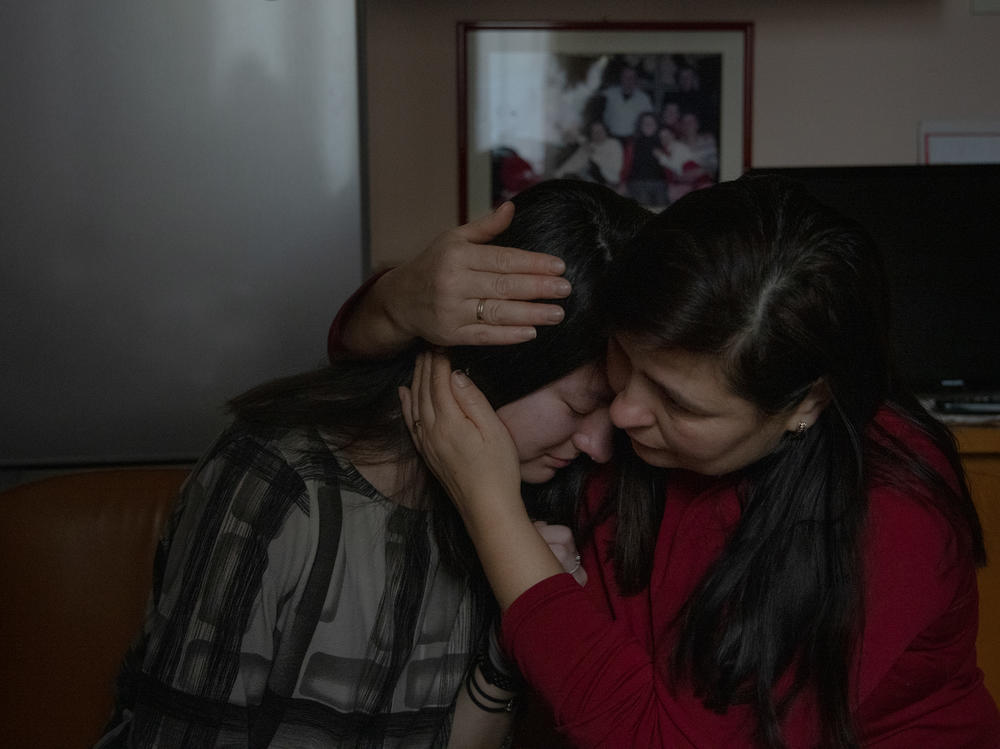 Lyubov Mala huggs her daughter Khrystyna Mala the morning she arrived in Italy from Ukraine after the beginning of the war on March 3, 2022. Lyubov was relieved because Khrystyna managed to make it to Italy, arriving by bus a few weeks after the conflict started.
