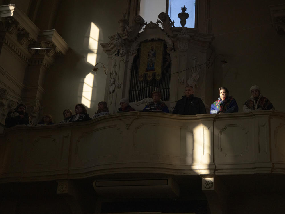 People attend services at the Ukrainian church in Bologna, Italy, when the community was praying for the tensions that were already looming between Russia and Ukraine in January 2022. Many caregivers use their free time to attend church. This is not only a way to ease the pain of distance but also to get together with friends with whom they can share common concerns.