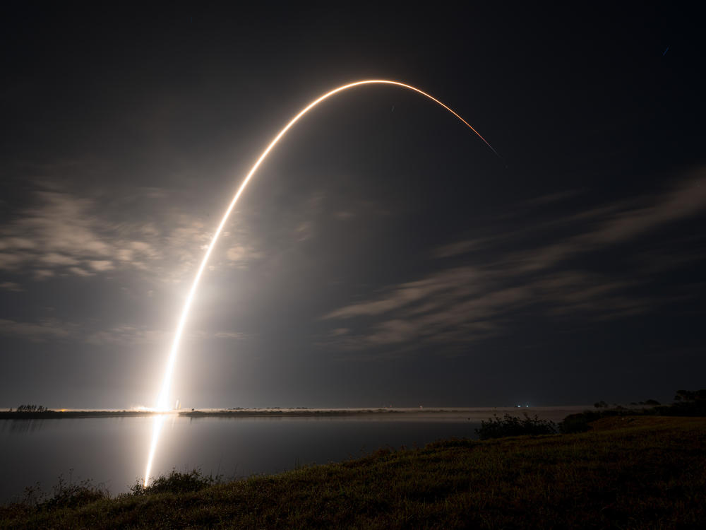 An undated photo shows a SpaceX Falcon 9 rocket carrying Starlink communications satellites into orbit. The Starlink constellation is made up of thousands of satellites that are difficult for adversaries to target.