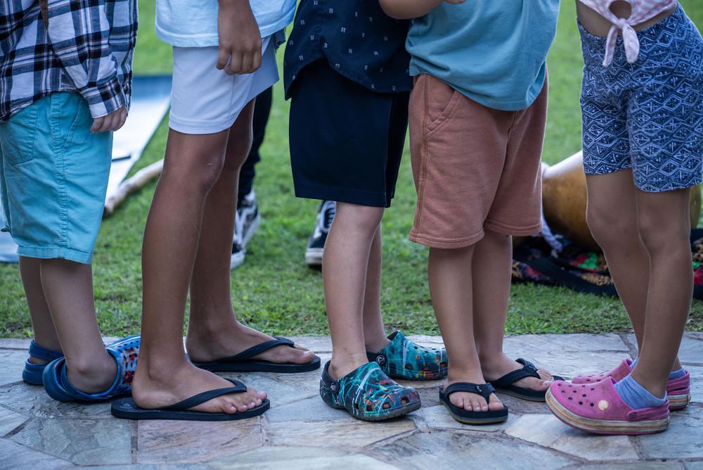 Kids line up after yoga class. Maui Arts and Cultural Center (MACC) Arts and Healing programming is held at the Royal Lahaina Resort where many displaced residents are temporarily staying.
