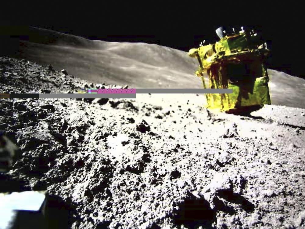 This image provided by the Japan Aerospace Exploration Agency/Takara Tomy/Sony Group Corporation/Doshisha University shows an image taken by a Lunar Excursion Vehicle 2 (LEV-2) of a robotic moon rover called Smart Lander for Investigating Moon, or SLIM, on the moon.