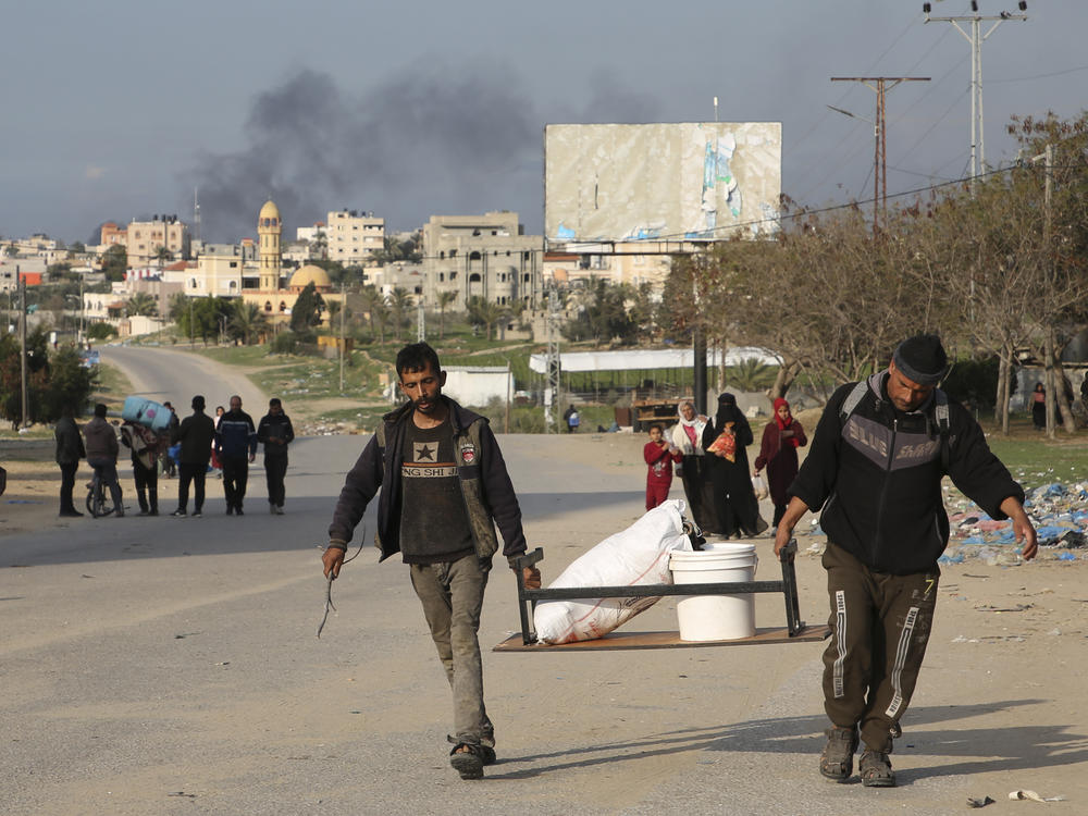 Palestinians are shown fleeing the Israeli offensive on Khan Younis arrive at Rafah, Gaza Strip. Wednesday, Feb. 14, 2024.