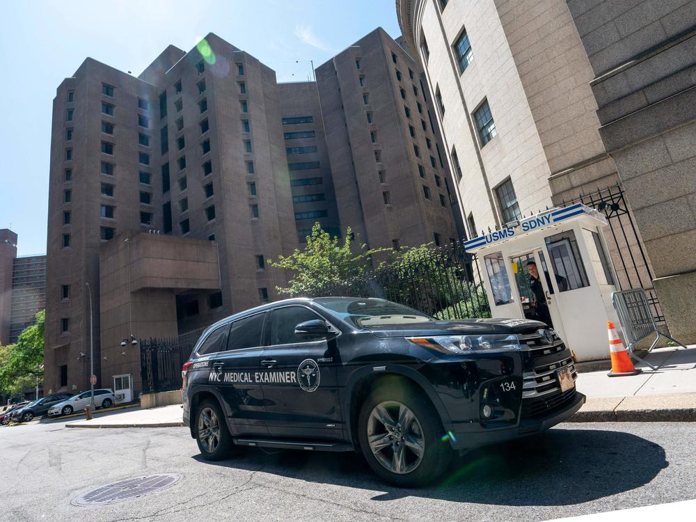 A New York Medical Examiner's car is parked outside the Metropolitan Correctional Center where financier Jeffrey Epstein was being held in New York. Epstein committed suicide in prison.