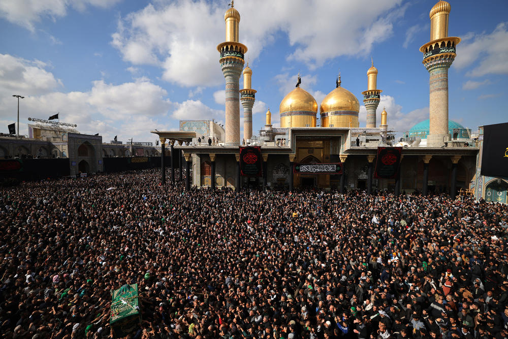 Shia Muslim pilgrims carry a symbolic coffin as they rally at the shrine of eighth century Imam Musa al-Kadhim during the yearly commemoration of his death in Baghdad's Kadhimiya district on Feb. 6.
