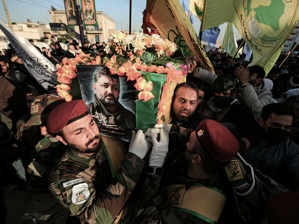 Fighters carry the coffin of Abu Baqir al-Saadi during his funeral on Feb. 8. He was a senior commander in Kataib Hezbollah, an Iran-backed Iraqi militia, who was killed in a U.S. drone strike in Baghdad.