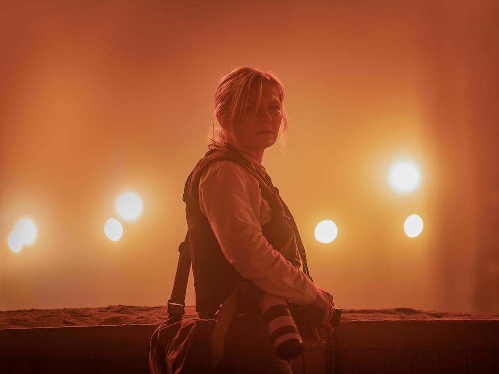 <em>Civil War</em> imagines a second civil war has broken out in the United States. Kirsten Dunst stars as a journalist in the film, which comes out April 12.