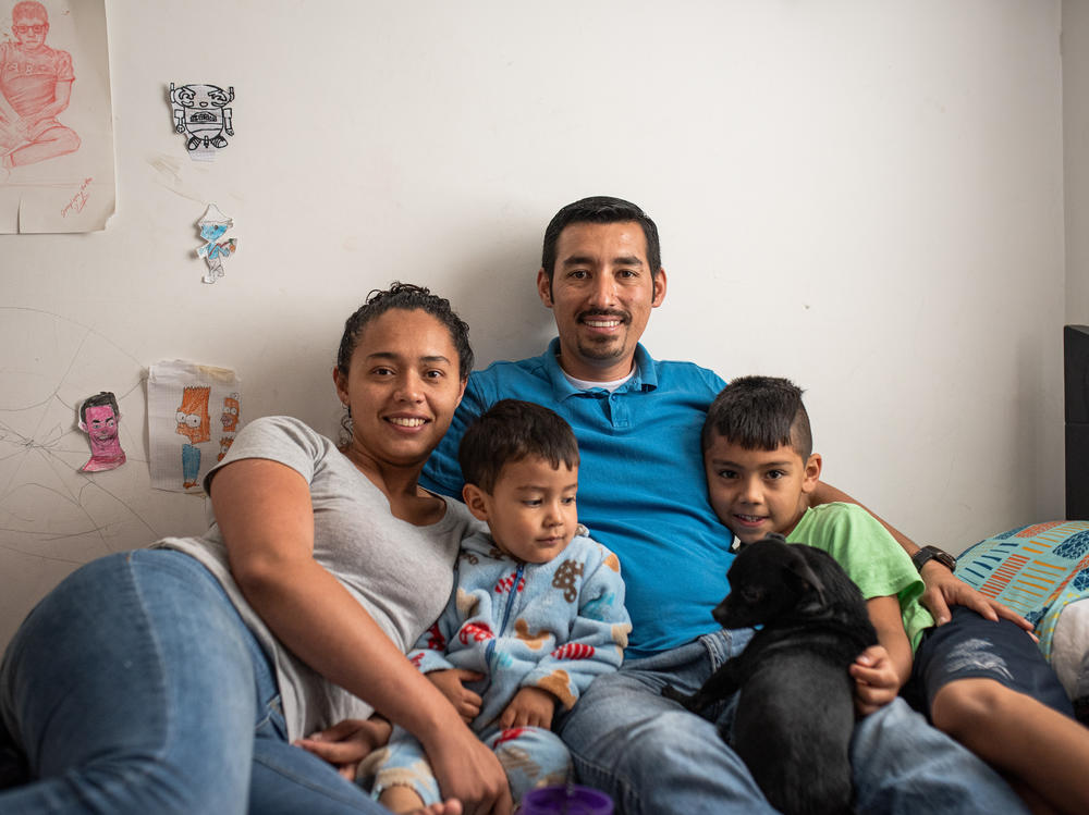 Ferley Sáenz credits the Care School for Men with making him a better dad. Here he poses with his sons, Jeronimo and Martin, and his wife, María Alejandra López.