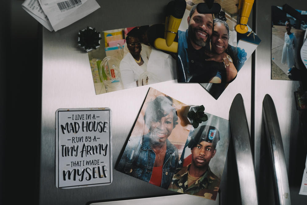 Photographs on Edmund Garcia's refrigerator.