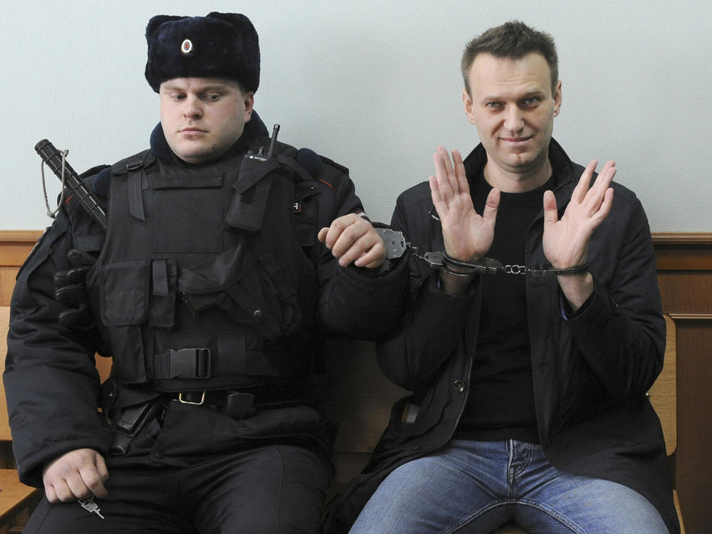 Russian opposition leader Alexei Navalny sits handcuffed in court in Moscow on March 30, 2017.