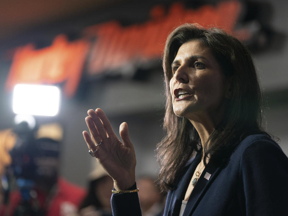 Republican presidential candidate former UN Ambassador Nikki Haley speaks to members of the media during a campaign event at Thunder Tower Harley Davidson Monday, Feb. 12 in Elgin, S.C. On the campaign trail, Haley has stepped up attacks against Vice President Kamala Harris, drawing parallels between herself and the vice president.