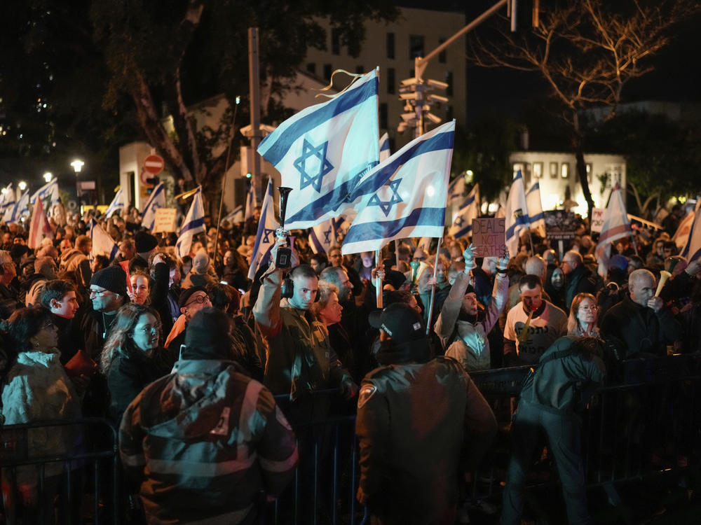 Demonstrators protest in Tel Aviv on Saturday, Feb. 17, against Israeli Prime Minister Benjamin Netanyahu, calling for new elections in the latest protest against his handling of the Israel-Hamas war.