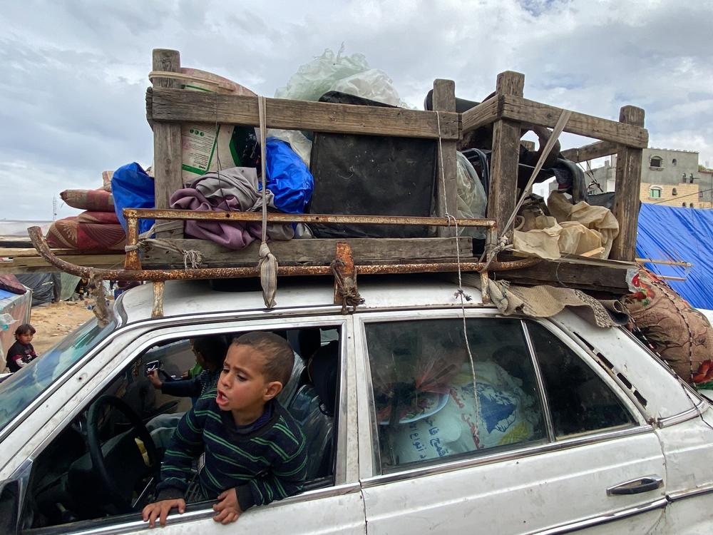 Palestinian families leave Rafah with their belongings on Monday, Feb. 12, as Israel threatens another military incursion in the southernmost Gaza city.