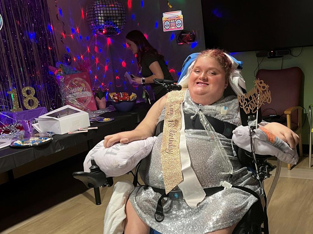 Alexis Ratcliff attends her 18th birthday party at the hospital in Winston-Salem, N.C. She is a quadriplegic who uses a ventilator and has lived at Atrium Health Wake Forest Baptist since she was 13.